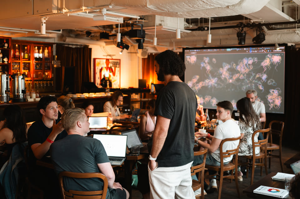A Light School AI day in London, with work shown on the big screen
