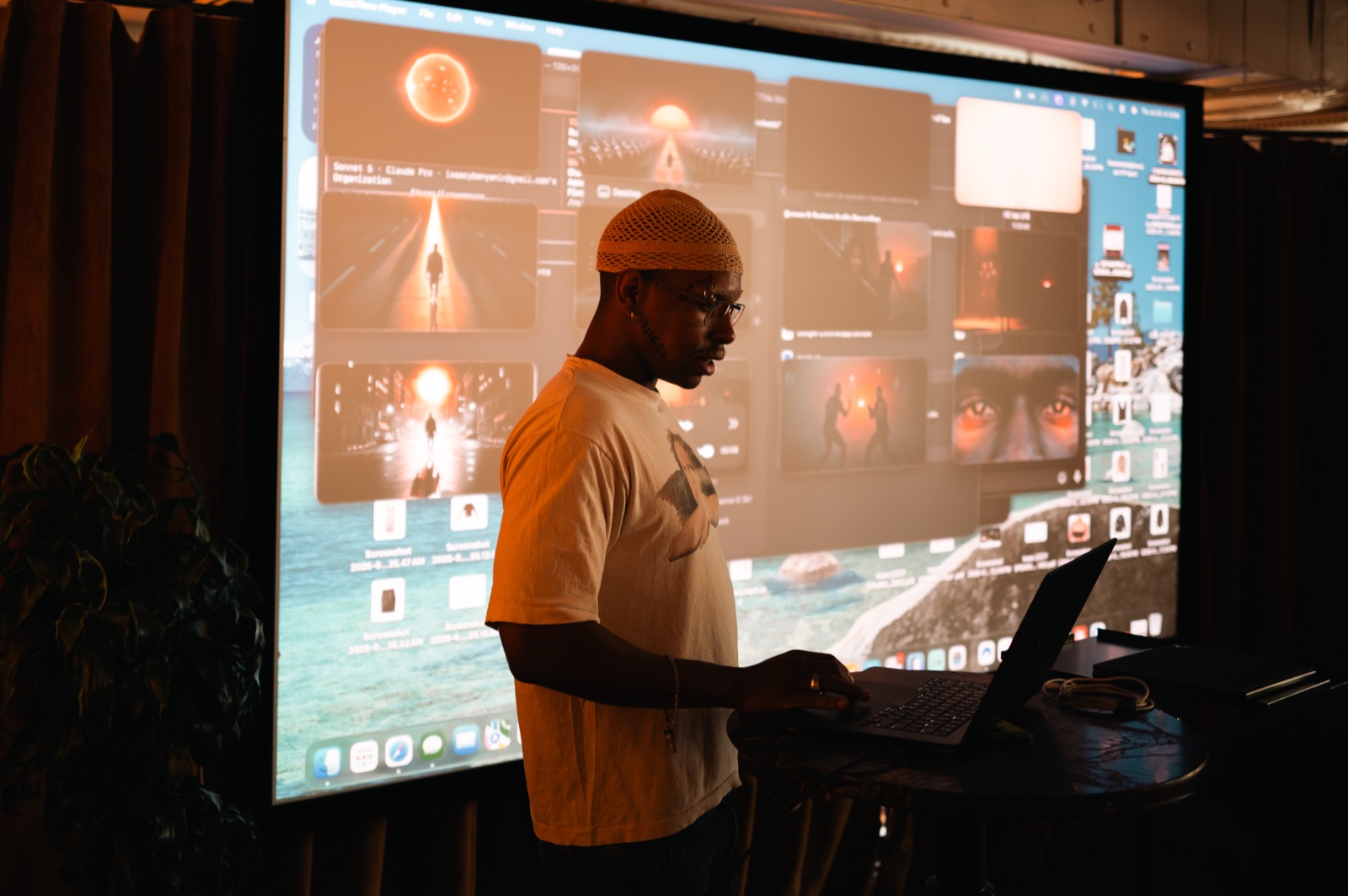 A trainer demonstrating an AI tool on a large screen to a team