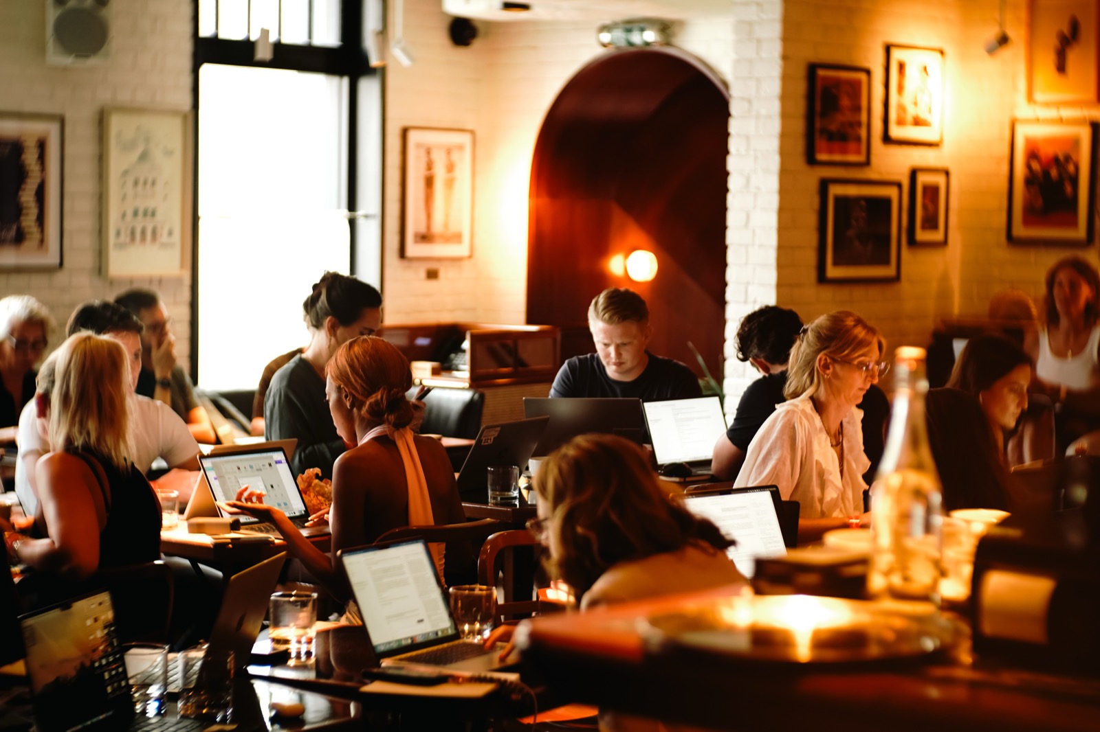 The room at a Light School AI day in London, filled with people building on laptops